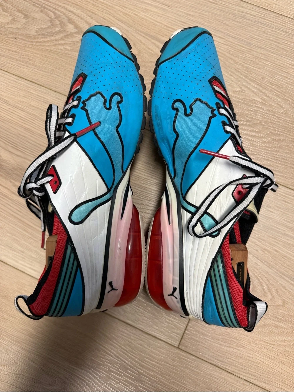 Puma Toori Run C, bold anime-inspired pop-art blue, white and red colorway 9.5